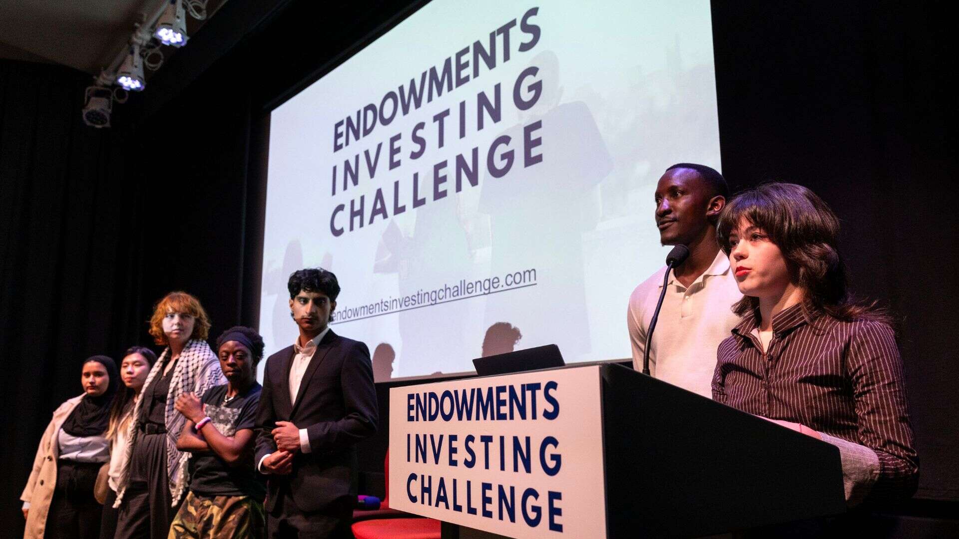 The Future Generations Panel presenting at the Endowments Investing Challenge event. Left to right - Viktoria, Lok-Yi, May, Jayden, Muhammed, Seth-Jesse, and Izzy.