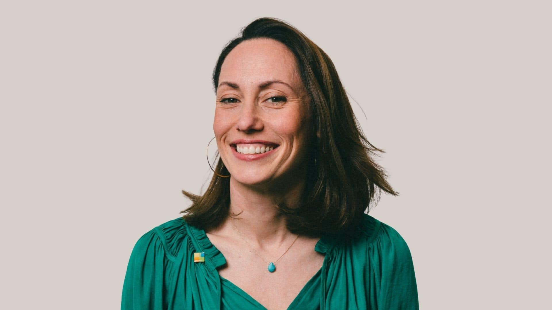 Natalie Nicholles - smiling to camera against a neutral background